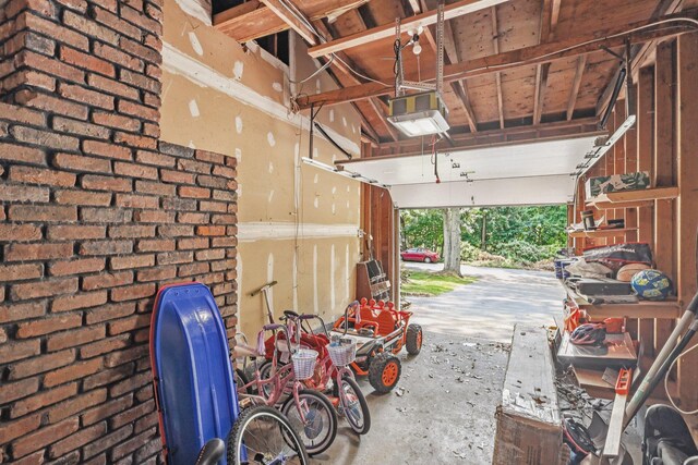 52 Iroquois Trl, Ridge, NY 11961 - garage featuring a garage door opener