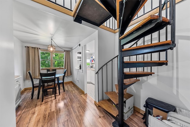 1302 Rte 22 Unit 1300, Brewster, NY 10509 - dining room with light wood-type flooring, stairs, and baseboards