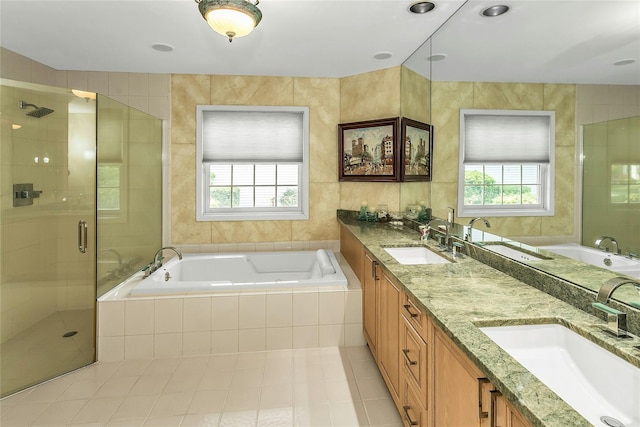 165 Country Club Dr, Commack, NY 11725 - bathroom with a garden tub, double vanity, a stall shower, tile patterned floors, and tile walls