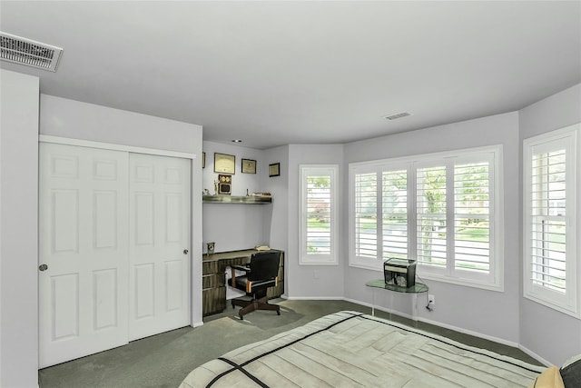 165 Country Club Dr, Commack, NY 11725 - carpeted bedroom featuring a desk, multiple windows, baseboards, and a closet