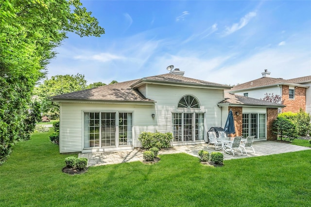 165 Country Club Dr, Commack, NY 11725 - rear view of property with a patio, a yard, and a chimney