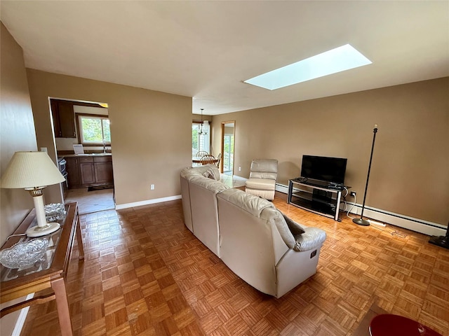 17 Wilson Rd, Brewster, NY 10509 - living area featuring a skylight and baseboard heating