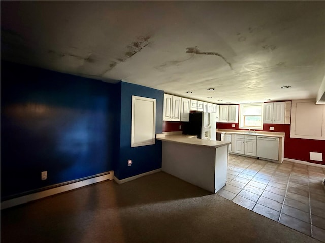 17 Wilson Rd, Brewster, NY 10509 - kitchen with fridge with ice dispenser, dishwasher, baseboard heating, a peninsula, and white cabinetry
