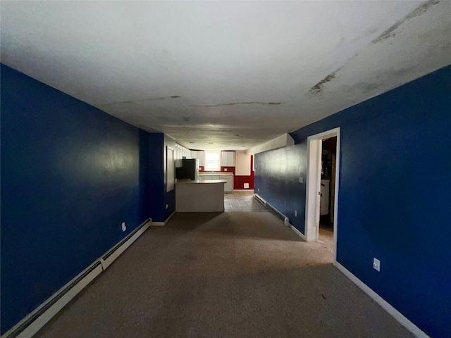 17 Wilson Rd, Brewster, NY 10509 - hallway with a baseboard radiator and dark carpet