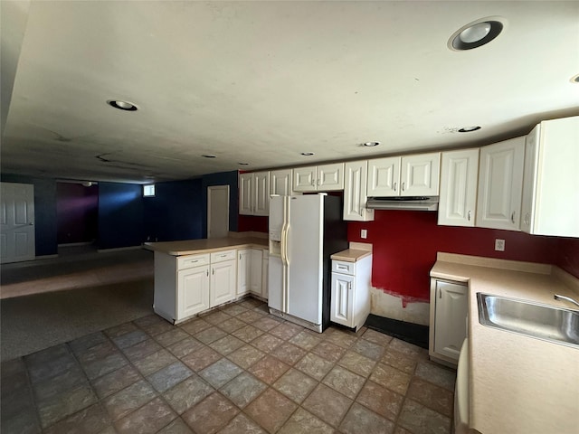 17 Wilson Rd, Brewster, NY 10509 - kitchen featuring white refrigerator with ice dispenser, under cabinet range hood, a peninsula, white cabinets, and recessed lighting