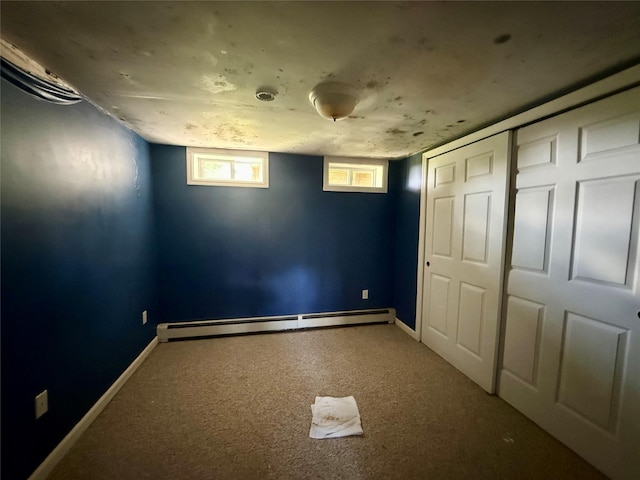 17 Wilson Rd, Brewster, NY 10509 - unfurnished bedroom with a baseboard heating unit, carpet flooring, and a closet