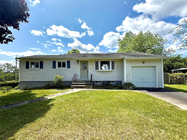 17 Wilson Rd, Brewster, NY 10509 - ranch-style home featuring concrete driveway, an attached garage, and a front yard