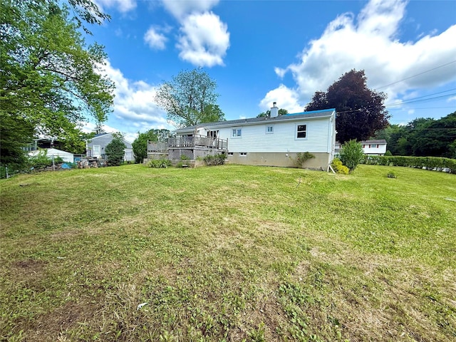17 Wilson Rd, Brewster, NY 10509 - rear view of property featuring a chimney and a yard