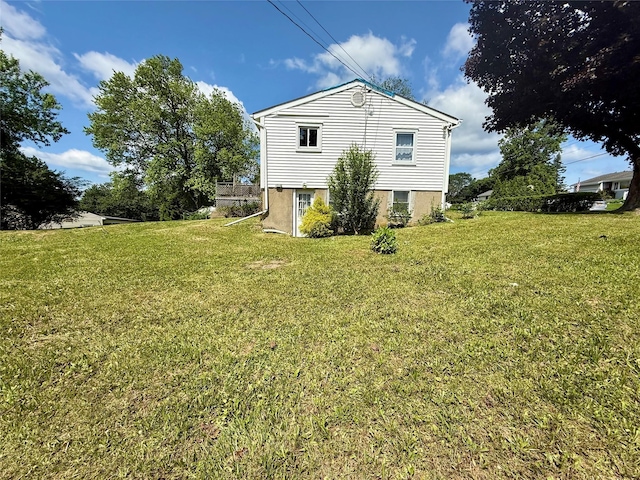 17 Wilson Rd, Brewster, NY 10509 - view of side of home featuring a lawn