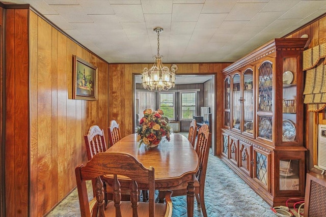 10364 52nd Ave, Flushing, NY 11368 - dining area with a chandelier, wooden walls, and carpet floors