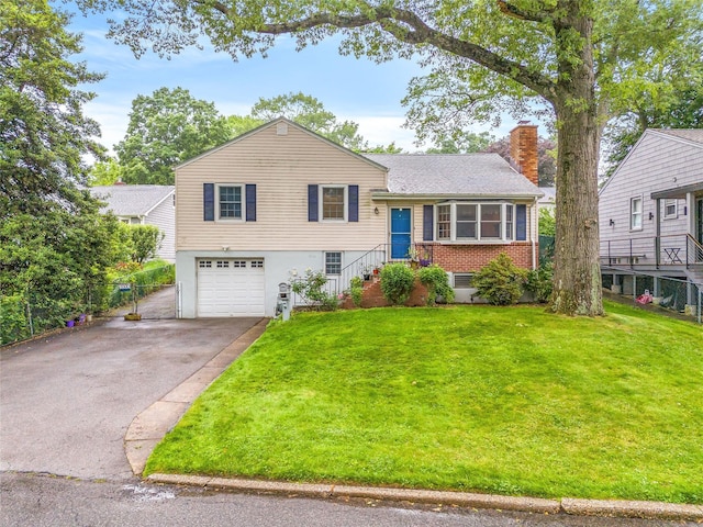 1400 Raleigh Rd, Mamaroneck, NY 10543 - split level home with driveway, a garage, a chimney, and brick siding