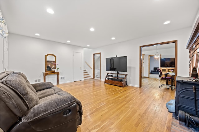 1400 Raleigh Rd, Mamaroneck, NY 10543 - living area with stairs, light wood-type flooring, and recessed lighting