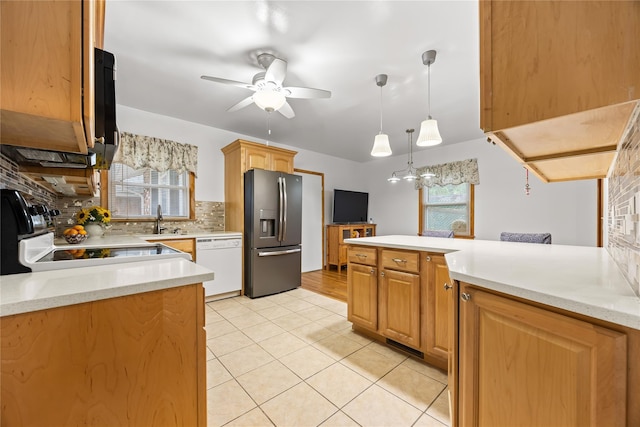 1400 Raleigh Rd, Mamaroneck, NY 10543 - kitchen with stainless steel refrigerator with ice dispenser, white dishwasher, range, decorative backsplash, and light tile patterned floors