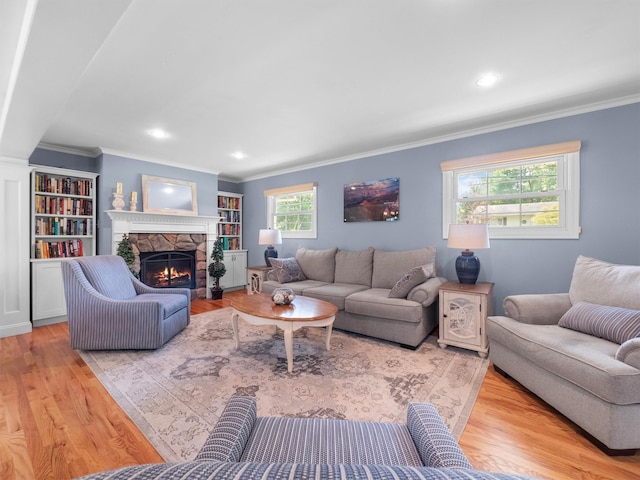 15 Tennyson Dr, Nanuet, NY 10954 - living room with crown molding, a stone fireplace, wood finished floors, and recessed lighting