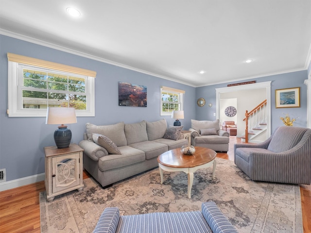 15 Tennyson Dr, Nanuet, NY 10954 - living area with wood finished floors, ornamental molding, baseboards, stairs, and recessed lighting