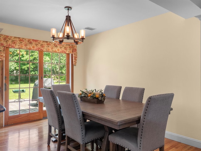 15 Tennyson Dr, Nanuet, NY 10954 - dining room with a chandelier, light wood finished floors, and baseboards