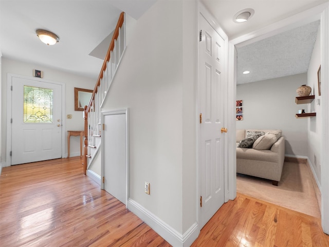 15 Tennyson Dr, Nanuet, NY 10954 - hall with stairs, light wood-style floors, and baseboards