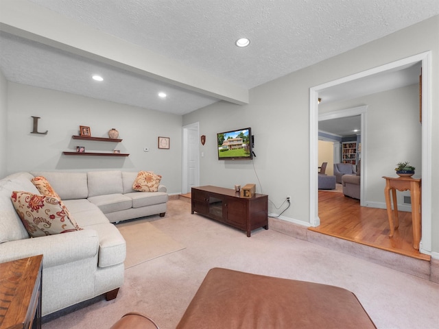 15 Tennyson Dr, Nanuet, NY 10954 - living room with carpet flooring, recessed lighting, a textured ceiling, baseboards, and beamed ceiling