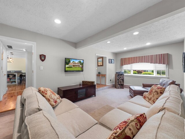 15 Tennyson Dr, Nanuet, NY 10954 - carpeted living area featuring a textured ceiling, recessed lighting, and baseboards