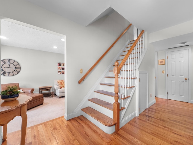 15 Tennyson Dr, Nanuet, NY 10954 - stairs featuring wood finished floors, baseboards, and recessed lighting