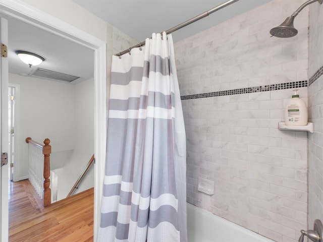 15 Tennyson Dr, Nanuet, NY 10954 - full bath with wood finished floors and shower / bathtub combination with curtain