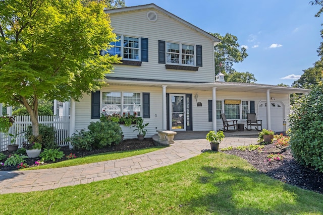 81 Brunswick Rd, Ronkonkoma, NY 11779 - traditional-style home featuring a porch and an attached garage