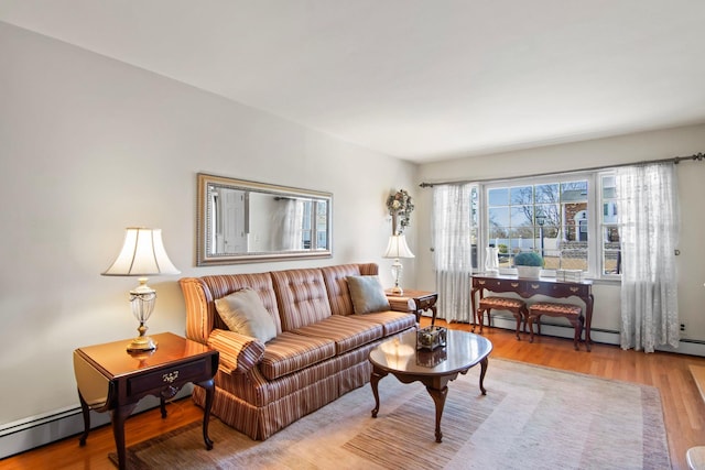 81 Brunswick Rd, Ronkonkoma, NY 11779 - living area featuring wood finished floors and a baseboard radiator