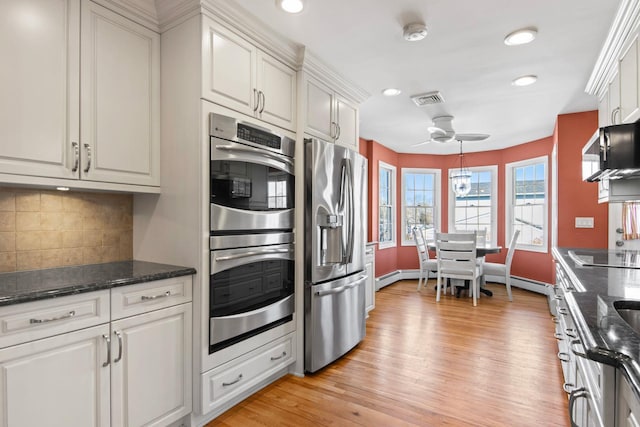 81 Brunswick Rd, Ronkonkoma, NY 11779 - kitchen with stainless steel appliances, a ceiling fan, recessed lighting, white cabinetry, and tasteful backsplash