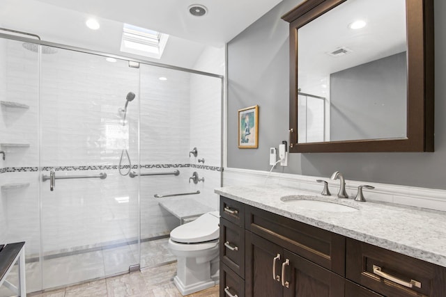 81 Brunswick Rd, Ronkonkoma, NY 11779 - bathroom with vanity, toilet, a skylight, a stall shower, and recessed lighting