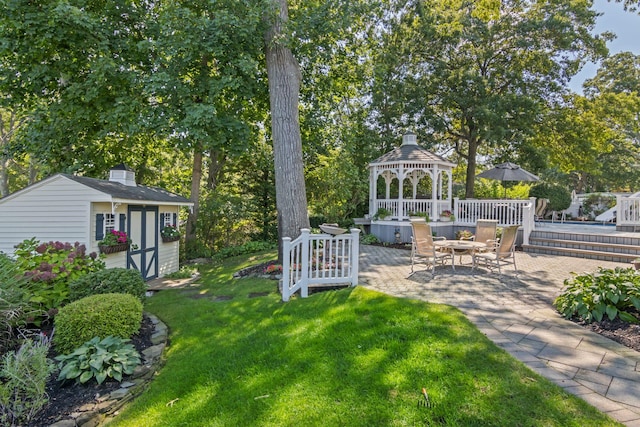 81 Brunswick Rd, Ronkonkoma, NY 11779 - view of green lawn featuring a gazebo, a patio area, an outdoor structure, and a wooden deck