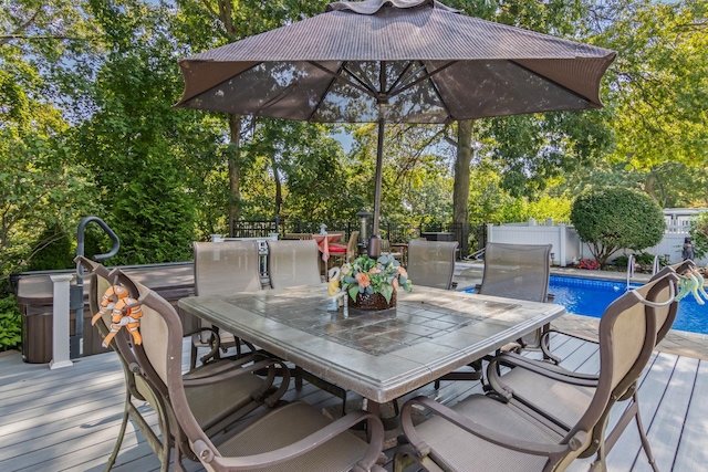 81 Brunswick Rd, Ronkonkoma, NY 11779 - deck featuring a fenced backyard, outdoor dining space, and view of scattered trees