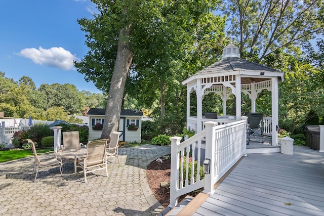 81 Brunswick Rd, Ronkonkoma, NY 11779 - wooden deck with an outbuilding, a gazebo, and a patio