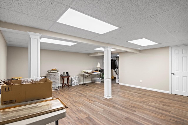 81 Brunswick Rd, Ronkonkoma, NY 11779 - finished below grade area with a paneled ceiling, wood finished floors, and baseboards