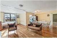 63-95 Austin St Unit 2F, Rego Park, NY 11374 - dining room featuring wood finished floors