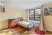 63-95 Austin St Unit 2F, Rego Park, NY 11374 - bedroom with wood finished floors