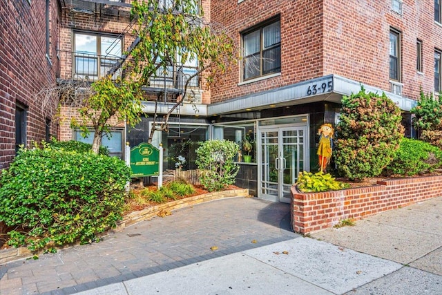 63-95 Austin St Unit 2F, Rego Park, NY 11374 - doorway to property with brick siding and french doors