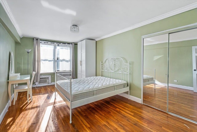 63-95 Austin St Unit 2F, Rego Park, NY 11374 - bedroom with crown molding, wood finished floors, and a wall mounted air conditioner