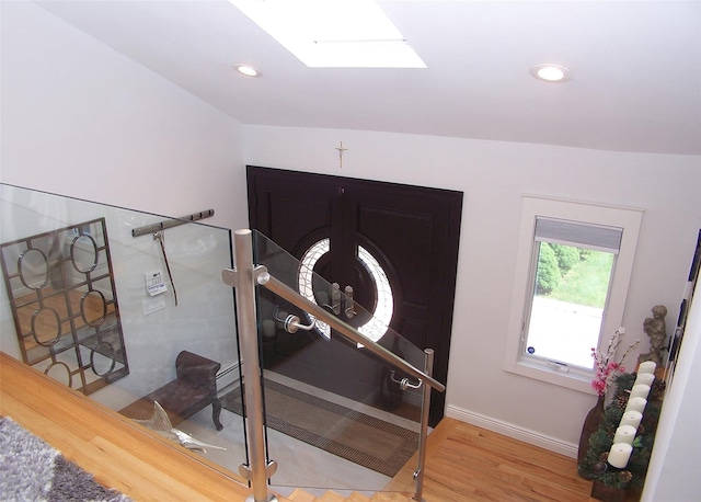 12 Sound View Dr, Rocky Point, NY 11778 - stairs featuring wood finished floors, a skylight, and recessed lighting