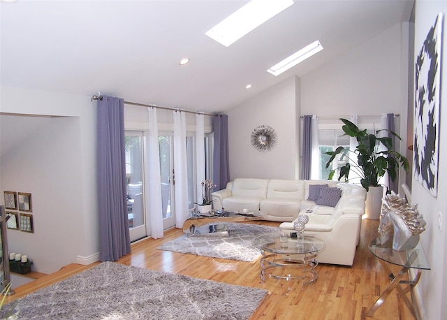 12 Sound View Dr, Rocky Point, NY 11778 - living area with wood finished floors, high vaulted ceiling, recessed lighting, and a skylight