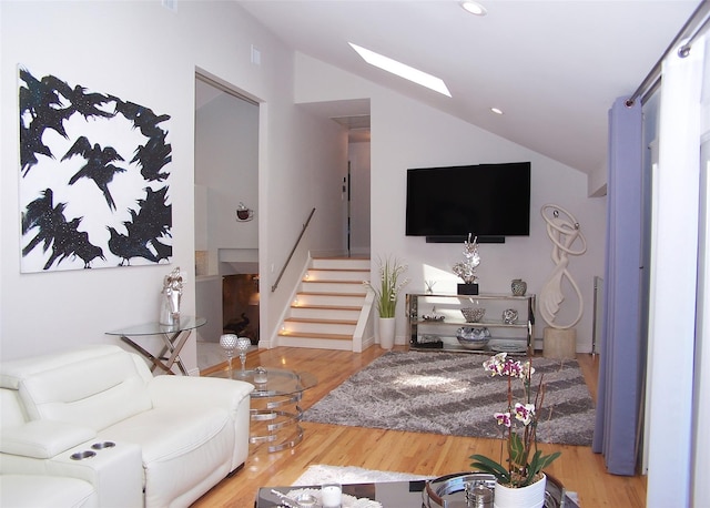 12 Sound View Dr, Rocky Point, NY 11778 - living area with lofted ceiling, stairs, wood finished floors, a skylight, and recessed lighting