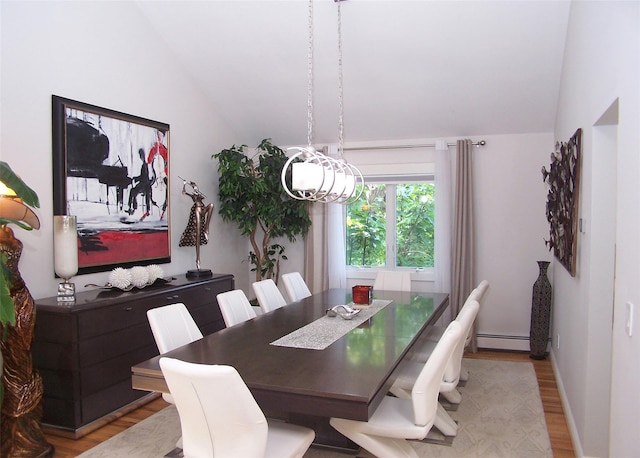 12 Sound View Dr, Rocky Point, NY 11778 - dining area featuring vaulted ceiling, wood finished floors, a baseboard heating unit, and a chandelier