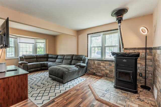 72 Parkway Blvd, Ronkonkoma, NY 11779 - living area featuring a wood stove and wood finished floors