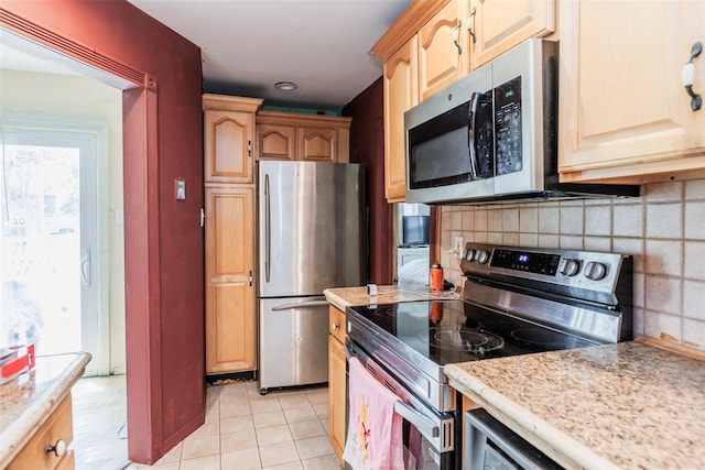 72 Parkway Blvd, Ronkonkoma, NY 11779 - kitchen featuring appliances with stainless steel finishes, light countertops, backsplash, and light tile patterned floors