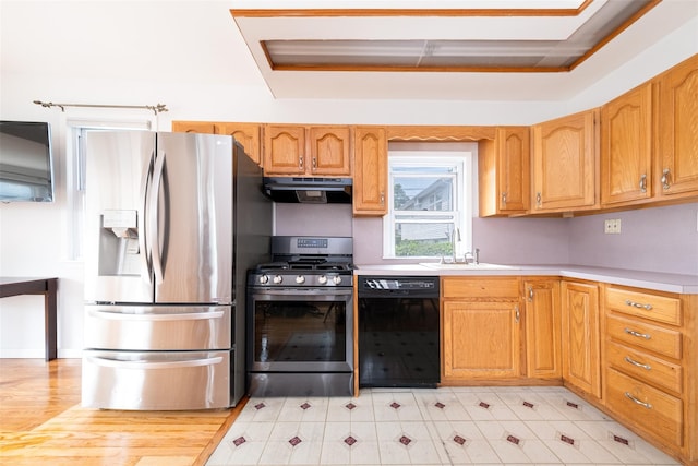6 Beech Pl Unit 6, Bronx, NY 10465 - kitchen with stainless steel appliances, extractor fan, a sink, and light countertops