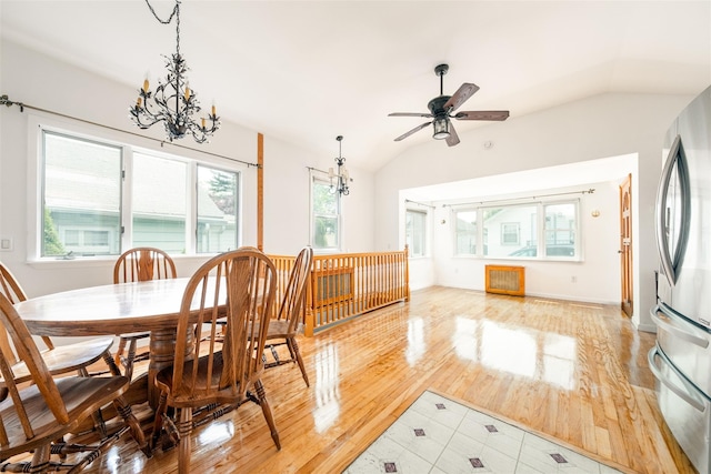 6 Beech Pl Unit 6, Bronx, NY 10465 - dining area featuring vaulted ceiling, a chandelier, a ceiling fan, and light wood-style flooring