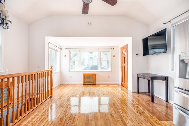 6 Beech Pl Unit 6, Bronx, NY 10465 - unfurnished living room featuring vaulted ceiling, light wood-style flooring, a ceiling fan, and baseboards