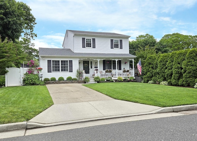 53 Admiral St, Port Jefferson Station, NY 11776 - view of front of property with a porch, a front yard, a gate, and driveway