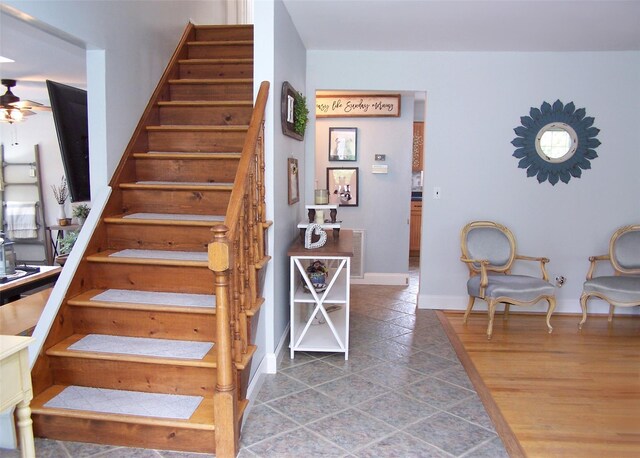 53 Admiral St, Port Jefferson Station, NY 11776 - stairs featuring baseboards, a ceiling fan, and tile patterned flooring