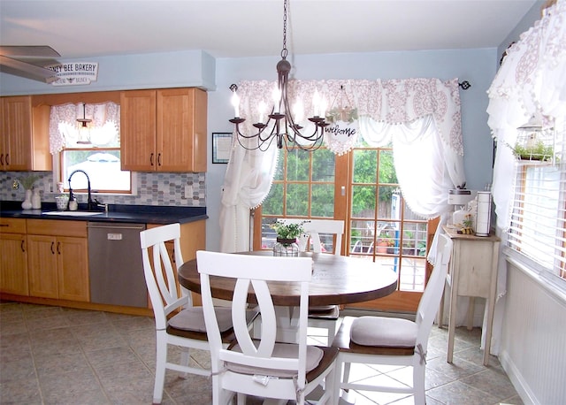 53 Admiral St, Port Jefferson Station, NY 11776 - dining room with a chandelier, healthy amount of natural light, and light tile patterned flooring