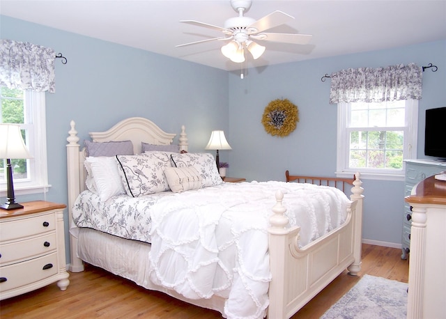 53 Admiral St, Port Jefferson Station, NY 11776 - bedroom with light wood-style flooring and a ceiling fan